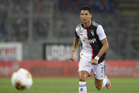 Cristiano Ronaldo with his eyes on the ball as he chases it