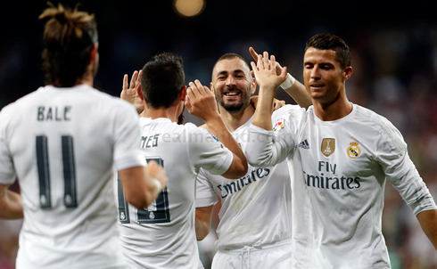 Cristiano Ronaldo and Benzema high five for James