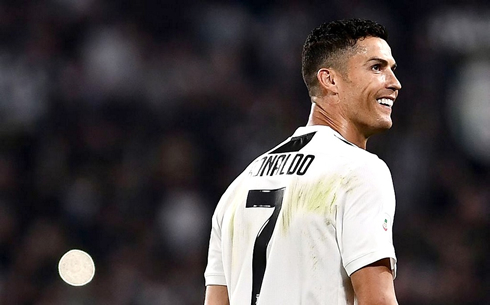 Cristiano Ronaldo smiling to his family in the crowd