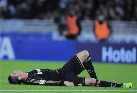 Cristiano Ronaldo looking exhausted, lays on the ground