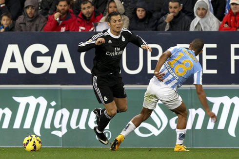 Cristiano Ronaldo getting tripped by an opponent, in Malaga vs Real Madrid