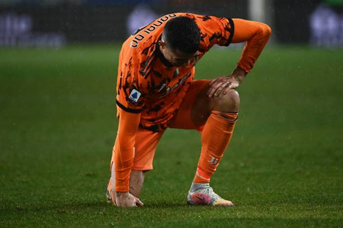 Cristiano Ronaldo trying to stand up after falling