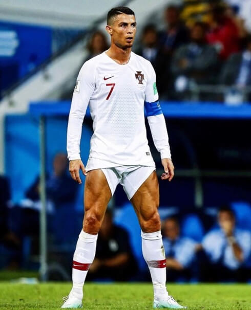 Cristiano Ronaldo preparing to take a free-kick with this shorts pulled up