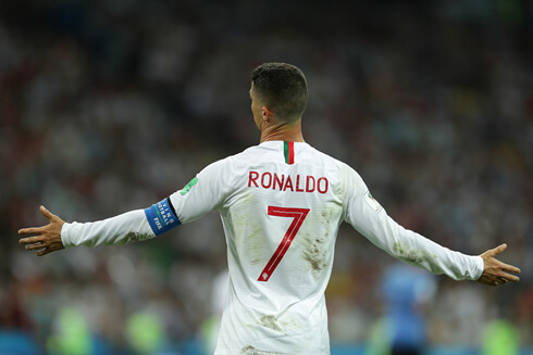 Cristiano Ronaldo opens his arms questioning the referee