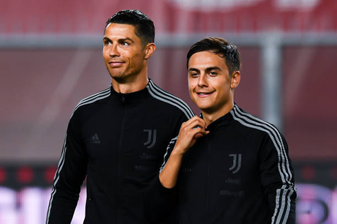Cristiano Ronaldo and Paulo Dybala wearing Juventus training jackets