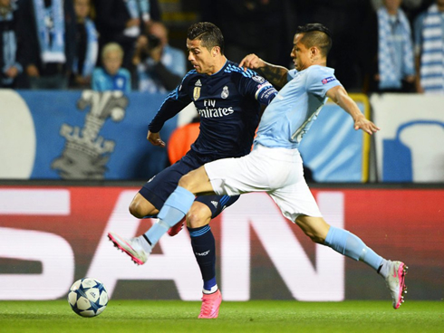 Cristiano Ronaldo trying to avoid a tackle, in Malmo 0-2 Real Madrid