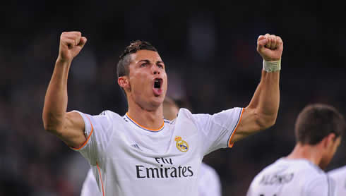 Cristiano Ronaldo showing how strong he is by raising his two arms