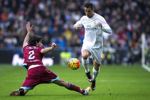 Cristiano Ronaldo jumps over a defender's leg to get past him