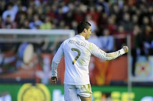 Cristiano Ronaldo turning to the Real Madrid bench and showing his closed fist, as a sign of power and strenght