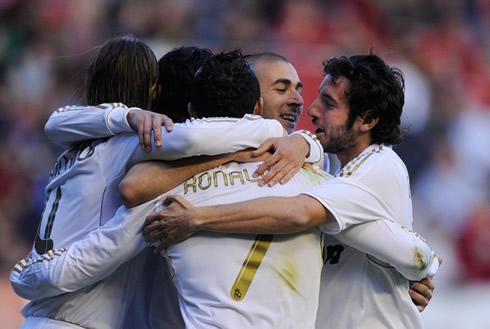 Cristiano Ronaldo hugging Real Madrid players, after another goal for the club in La Liga