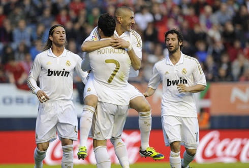 Benzema jumping to Cristiano Ronaldo lap, while Sergio Ramos and Granero join them in Real Madrid goal celebrations in 2012