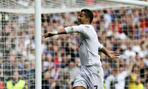 Cristiano Ronaldo preparing to jump and turn around in the air after scoring yet another goal for Real Madrid