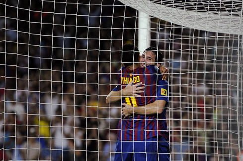 Thiago Alcântara hugging Lionel Messi in a Barcelona game