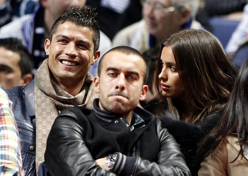 Cristiano Ronaldo smiling with Irina Shayk, in a Real Madrid vs Barcelona game, in basketball