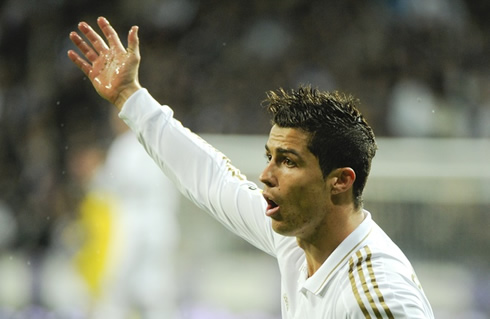 Cristiano Ronaldo raising his right arm, claiming for something at the referee, in a Real Madrid game for La Liga in 2011/2012