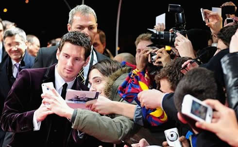 Lionel Messi taking a photo with fans at FIFA Balon d'Or 2011-2012 red carpet entrance