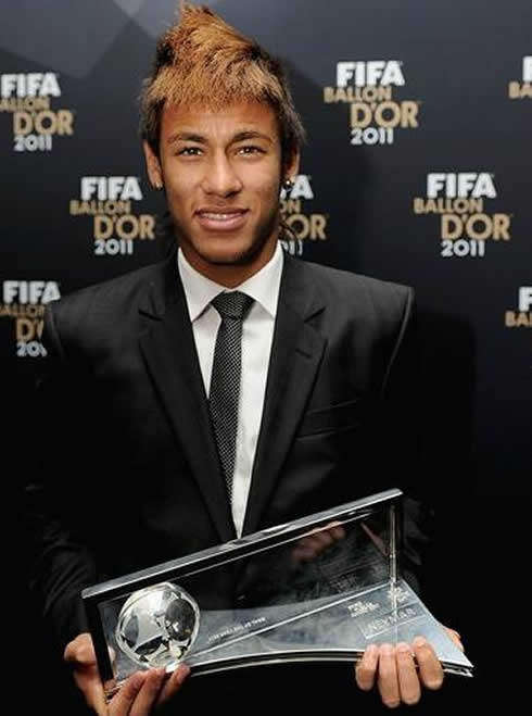 Neymar showing his Puskas Goal of the Year trophy, won at the FIFA Balon d'Or 2011-2012 gala and ceremony