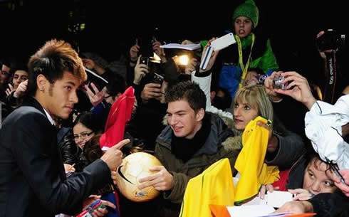 Neymar signing autographs at FIFA's Balon d'Or 2011-2012 gala and ceremony