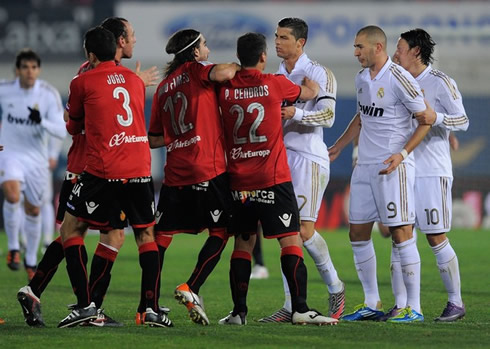 Cristiano Ronaldo defending his Real Madrid teammates Benzema and Ozil, while being pushed