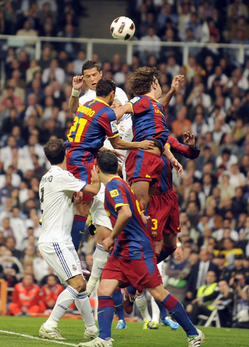 Cristiano Ronaldo jumping above any other player, in Real Madrid vs Barcelona in 2011-2012