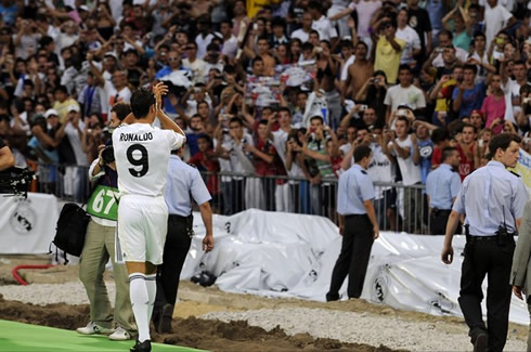 Cristiano Ronaldo and Lionel Messi entering the pitch at the Santiago Bernabéu, for a Real Madrid vs Barcelona Clasico, in 2011-2012