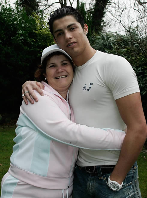 Cristiano Ronaldo in a white and tight Armani Jeans t-shirt, holding his mother, Maria Dolores dos Santos Aveiro