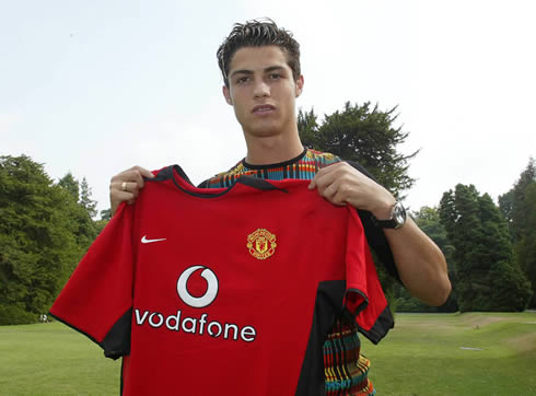Cristiano Ronaldo arriving at Manchester United and holding his new red jersey/shirt in 2003