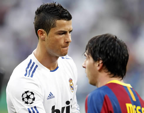 Cristiano Ronaldo and his biggest rival, Lionel Messi, while Real Madrid and Barcelona players salute each other before kickoff