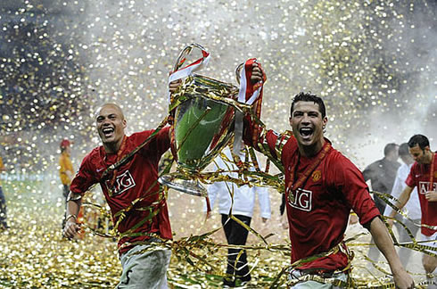 Cristiano Ronaldo and Wes Brown, running with the UEFA Champions League title, in Manchester United, in 2008