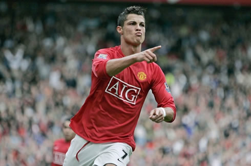 Cristiano Ronaldo celebrating a goal by pointing his finger at someone in the Manchester United bench