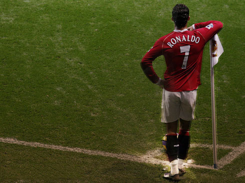 Cristiano Ronaldo holding to a corner kick flag, at Manchester United
