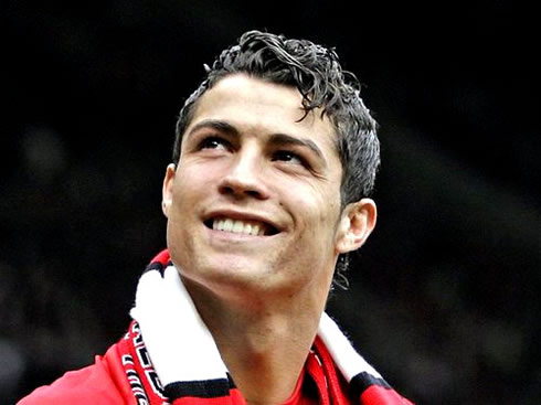 Cristiano Ronaldo smiling to fans, at Manchester United, in the Old Trafford