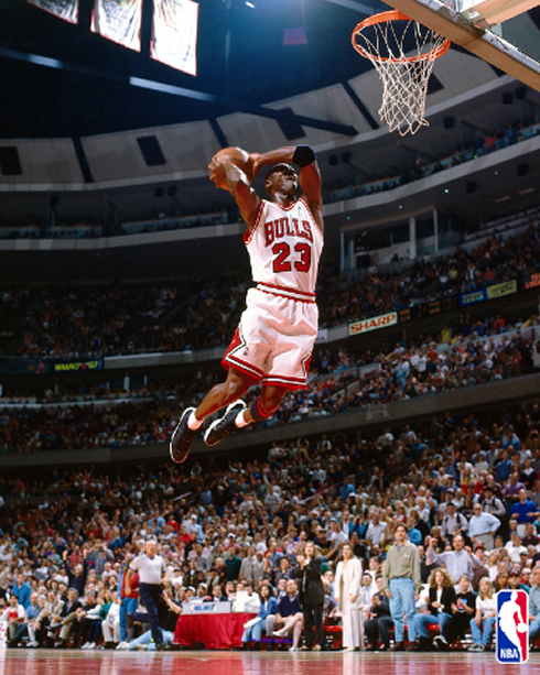 Michael Jordan flying to dunk for Chicago Bulls, in the NBA