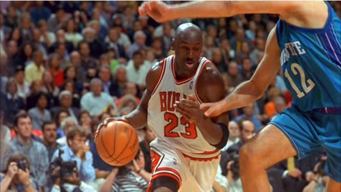 Michael Jordan playing in a Chicago Bulls vs Charlotte Bobcats game in the NBA