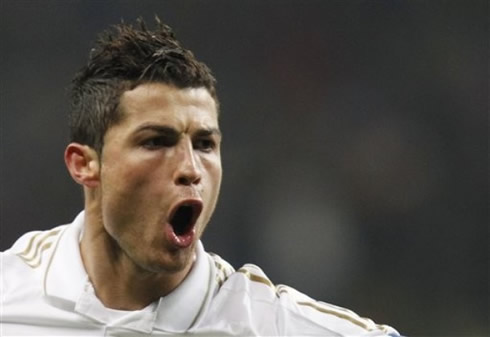 Cristiano Ronaldo strange face, opening his mouth when celebrating a goal for Real Madrid, in 2012