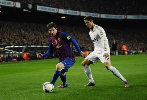 Cristiano Ronaldo playing against Lionel Messi, in a Barcelona vs Real Madrid game, in 2011-2012