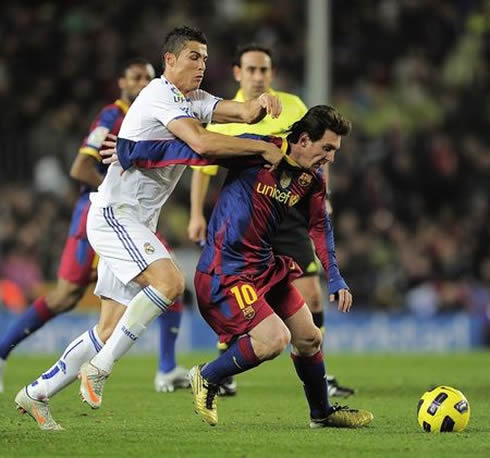 Cristiano Ronaldo tackling and pulling Lionel Messi from behind, in Barcelona vs Real Madrid, in 2011-2012