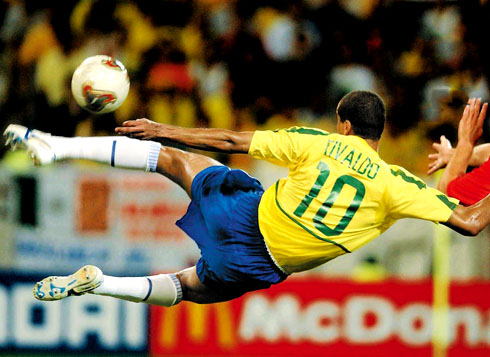 Rivaldo doing an acrobatic shot in a game for Brazil