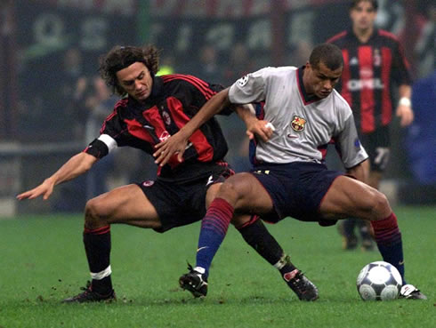 Rivaldo protecting the ball from Paolo Maldini, in Barcelona vs AC Milan, for the UEFA Champions League