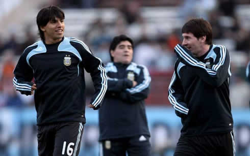 Diego Armando Maradona looking at Sergio Kun Aguero and Lionel Messi joking around in a training session for Argentina