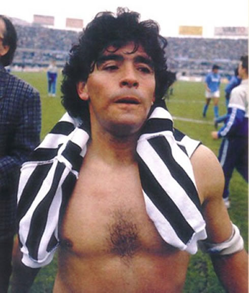 Diego Armando Maradona shirtless, showing his body and muscles, after a Napoli game