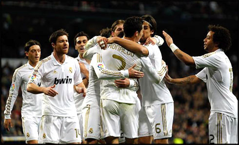 Cristiano Ronaldo and Real Madrid players, Mesut Ozil, Xabi Alonso, Sami Khedira, and Marcelo, celebrating a goal against Espanyol, in 2012
