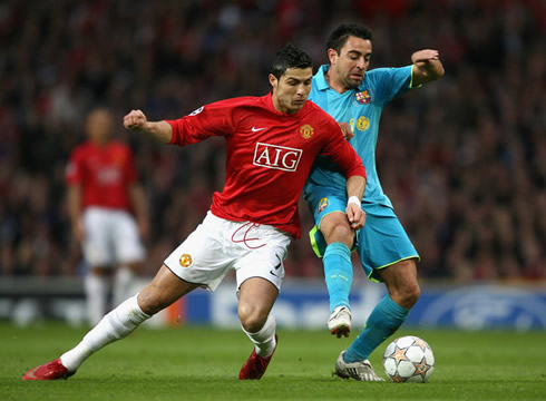 Cristiano Ronaldo being taclked by Xavi Hernandez, in Barcelona vs Manchester United, at the Champions League 2008-2009