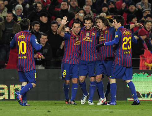 Messi, Xavi, Fabregas, Puyol and Isaac Cuenca, celebrating a goal for Barcelona in 2012