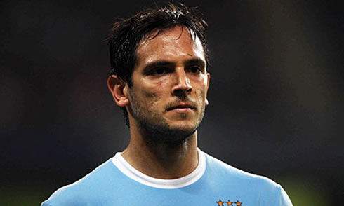 Roque Santa Cruz with some scars and holes on his face, at Manchester City