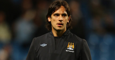 Roque Santa Cruz wearing a Manchester City jacket