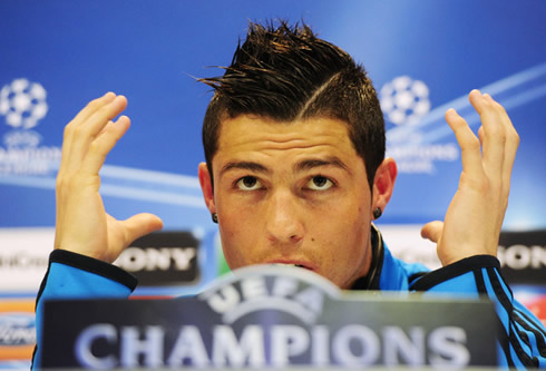 Cristiano Ronaldo making a big head gesture, showing his unique haircut and hairstyle in 2012