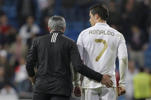 Cristiano Ronaldo being touched in the ass by José Mourinho, at the end of a Real Madrid game