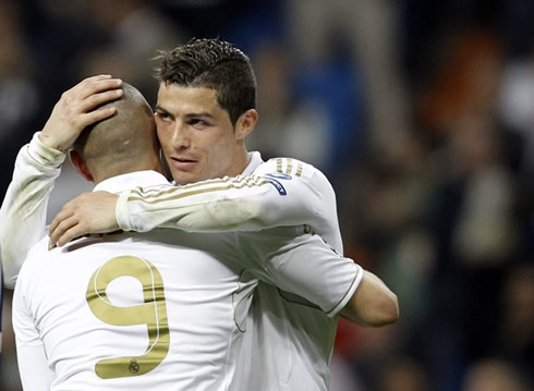 Cristiano Ronaldo hugging Karim Benzema, as they celebrate a Real Madrid goal in 2012