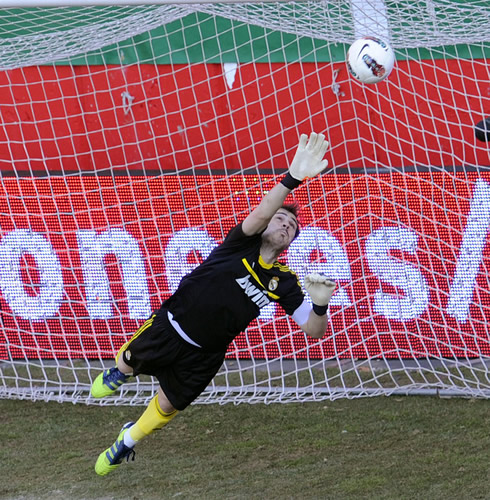 Iker Casillas big effort to reach the ball